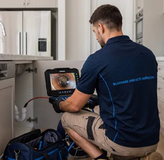 Clearing a blocked sink at a Glenmore Park property